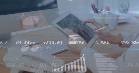 Mid-adult woman tapping tablet with financial analytics hud overlays in modern workspace