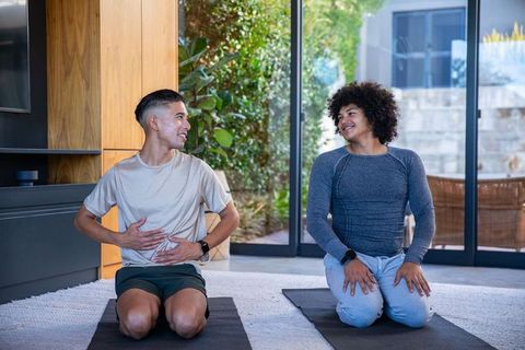 Diverse friends practicing mindfulness breathing at home