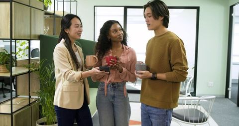 Diverse Professionals Collaborating in Office Break Room