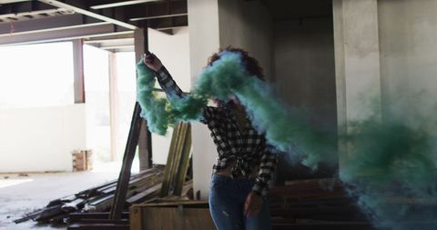 Woman Holding Green Smoke Bomb in Abandoned Building - Download Free Stock Images Pikwizard.com