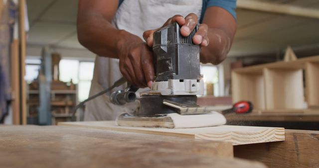 Carpenter Using Sander for Polishing Wood in Workshop - Download Free Stock Images Pikwizard.com