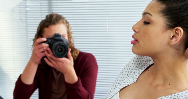 Young Female Photographer Captures Model's Profile in Creative Photoshoot - Download Free Stock Images Pikwizard.com