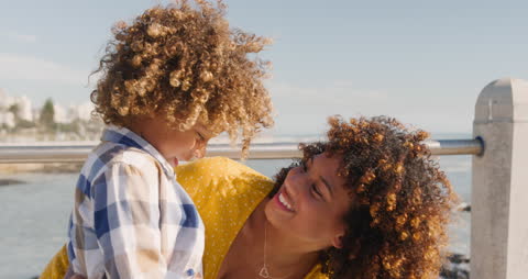 Mother and Son Enjoying Seaside on Sunny Day