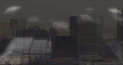 High-Rise Windows Reflecting Ceiling Lights Over Urban Skyline