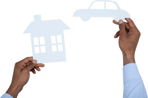Transparent house and car paper cutouts in hands