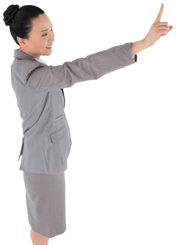 Asian Businesswoman Pointing with Enthusiasm on Transparent Background