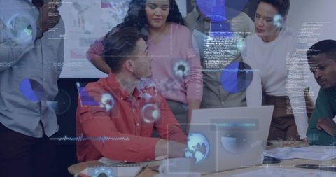 Multicultural team collaborating around laptop with holographic data visualizations