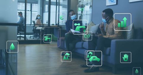 Eco Icons Over Professionals in Modern Office on Environmental Issues