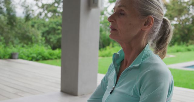 Senior Woman Meditating Outdoors in Tranquil Garden - Download Free Stock Images Pikwizard.com