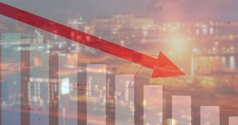 Declining business performance over city skyline sunset with red downward arrow