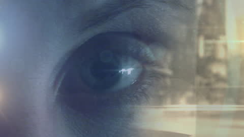 Caucasian Woman's Blinking Eye with Abstract Light Effects