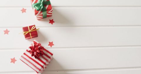 Christmas Gifts with Red and Green Ribbons on White Wood - Download Free Stock Images Pikwizard.com