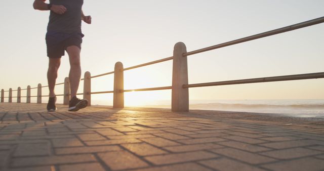 Jogging Along the Beachfront at Sunrise - Download Free Stock Images Pikwizard.com