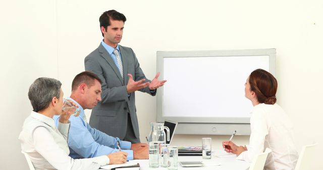 Business Team Engaging in Formal Presentation in Modern Office - Download Free Stock Images Pikwizard.com