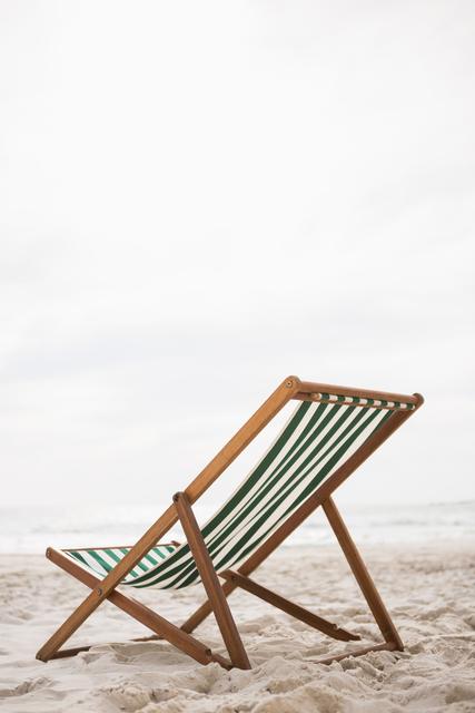 Empty beach chairs on tropical sand beach