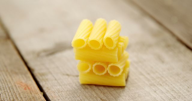 Close-Up of Raw Rigatoni Pasta on Rustic Wooden Table - Download Free Stock Images Pikwizard.com