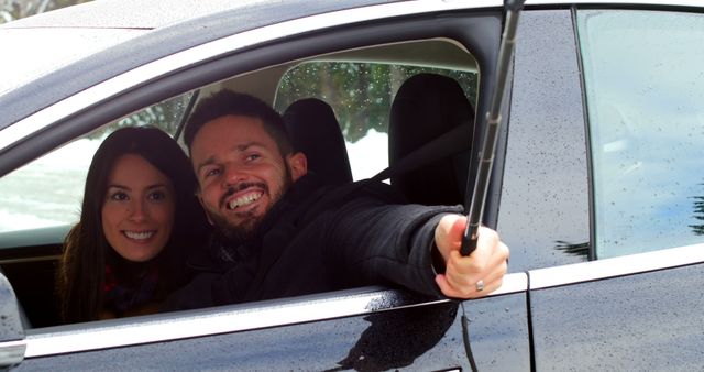 Couple Taking Selfie During Winter Drive in Snowy Landscape - Download Free Stock Images Pikwizard.com