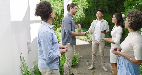 Joyful guests at wedding celebration sharing laughter and conversation