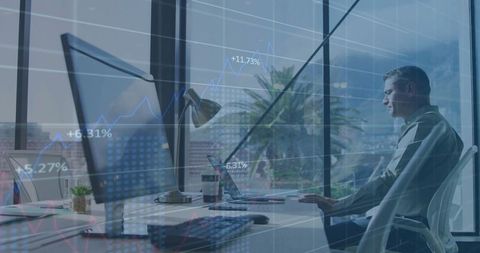 Business Professional Analyzing Stock Market Trends on Computer in Office