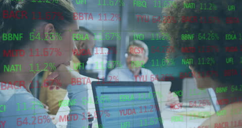 Business Team Analyzing Digital Stock Market Reports in Office