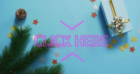 Neon click here call-to-action holiday flatlay with gift, pine branches, confetti