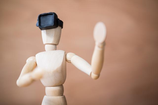 Figurine using a virtual reality headset - Download Free Stock Photos Pikwizard.com