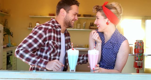 Retro Couple Enjoying Milkshakes at Diner - Download Free Stock Images Pikwizard.com