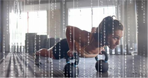 Female athlete performing renegade row with kettlebells on gym floor, binary code overlay