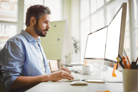 man using desktop computer in bright office space with transparent screens - Download Free Stock Videos Pikwizard.com