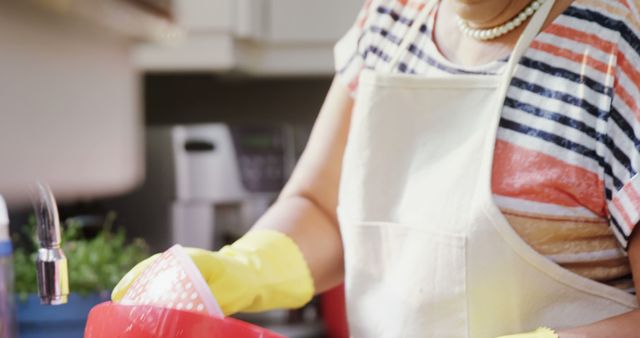 Woman Washing Dishes in Kitchen with Yellow Gloves - Download Free Stock Images Pikwizard.com