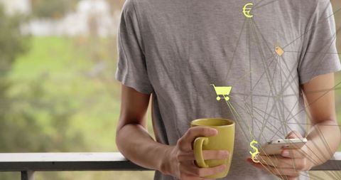 Man Using Smartphone with Coffee Cup and Digital Icons Overlay