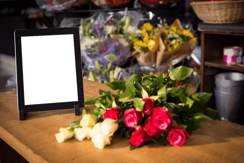 transparent tablet display with fresh flowers in florist shop - Download Free Stock Videos Pikwizard.com
