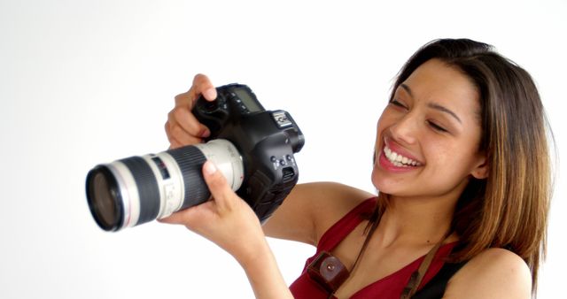 Smiling Woman Photographer Holding Professional Camera - Download Free Stock Images Pikwizard.com