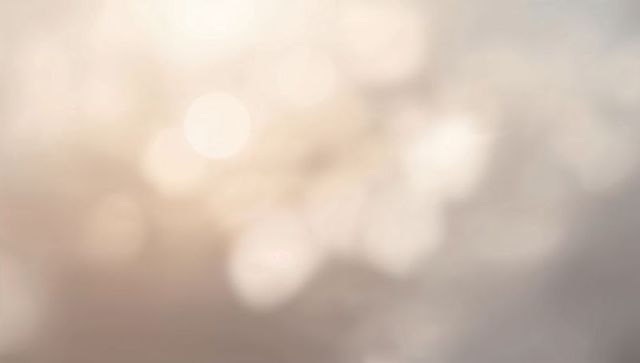 Warm Soft Bokeh Glow Background with Blurred Light Spots and Gentle Creamy Gradients
