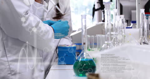 Scientists Analyzing Chemical Reactions in Modern Laboratory