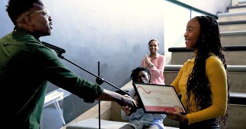 Corporate Seminar Speaker Shaking Hands while Receiving Certificate