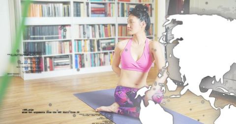 Korean woman practicing seated-twist yoga on blue mat at home with map overlay