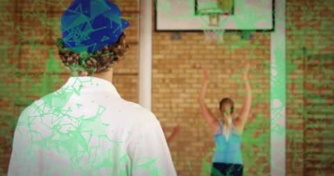 Teenage basketball practice with artistic green overlay