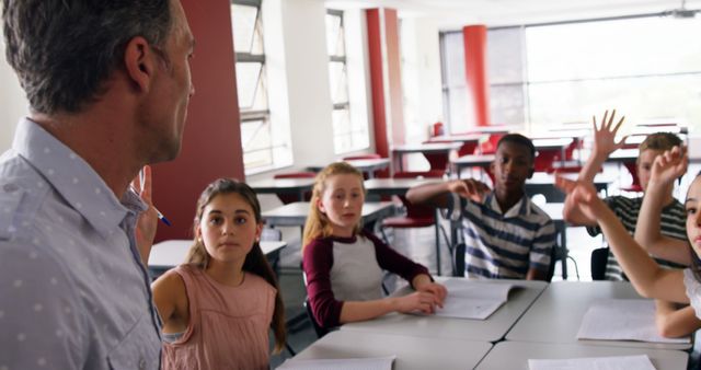 Teacher Engaging Curious Students in Modern Classroom - Download Free Stock Images Pikwizard.com