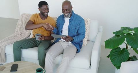 African American Friends Connecting Over Technology at Home