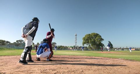 Team Baseball Game in Action at Sunlit Ballpark