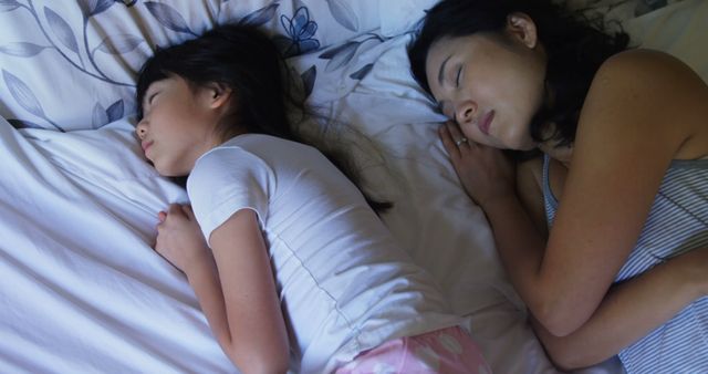 Mother and Daughter Sleeping on Bed with Floral Sheets - Download Free Stock Images Pikwizard.com