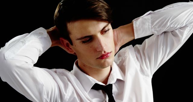 Stressed Young Businessman Tension Expression with Dark Background - Download Free Stock Images Pikwizard.com