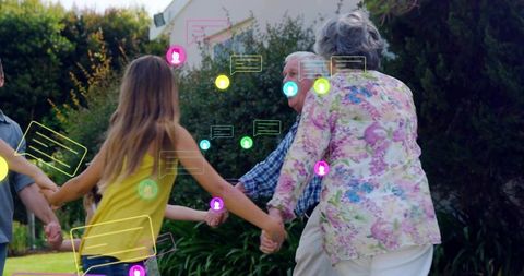 Multigenerational family holding hands forming circle in sunlit garden with chat bubbles