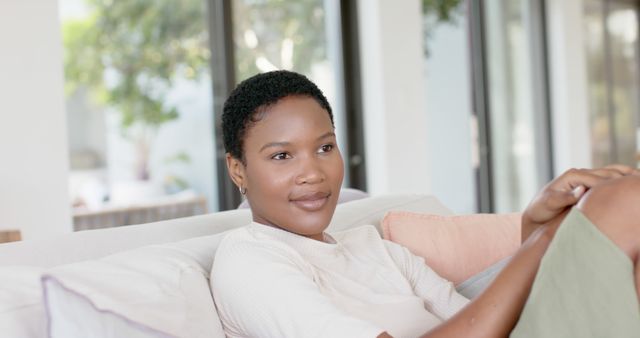 Woman Relaxing on Couch in Bright Living Room - Download Free Stock Images Pikwizard.com