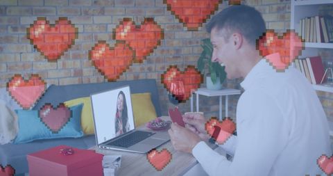 Man at laptop expressing love through virtual celebration