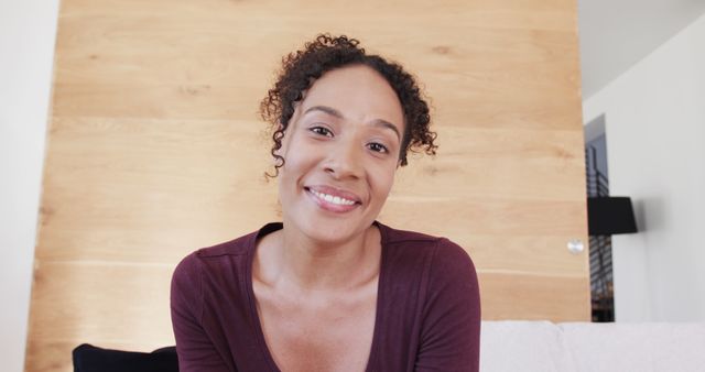 Smiling African American Woman Relaxing on Couch at Home - Download Free Stock Images Pikwizard.com