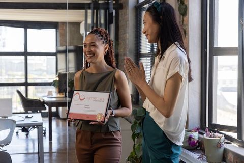 Celebrating Achievement in Modern Office with Award Presentation