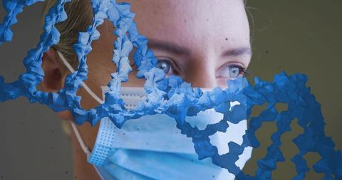Healthcare worker wearing surgical mask with blue dna helix weaving across portrait