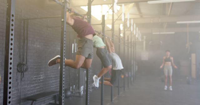 People Exercising on Pull-Up Bars in Gym with Trainer - Download Free Stock Images Pikwizard.com